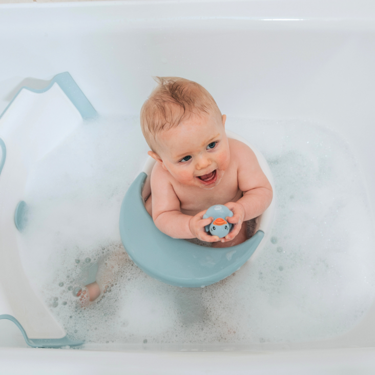 Baby playing with Bath Toy Ducks